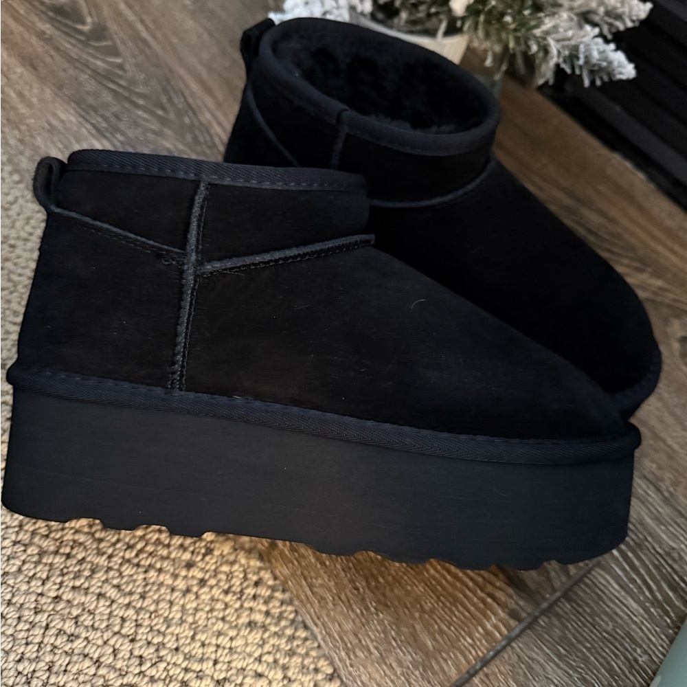 Women’s platform boots. New in box and sprayed w protector.